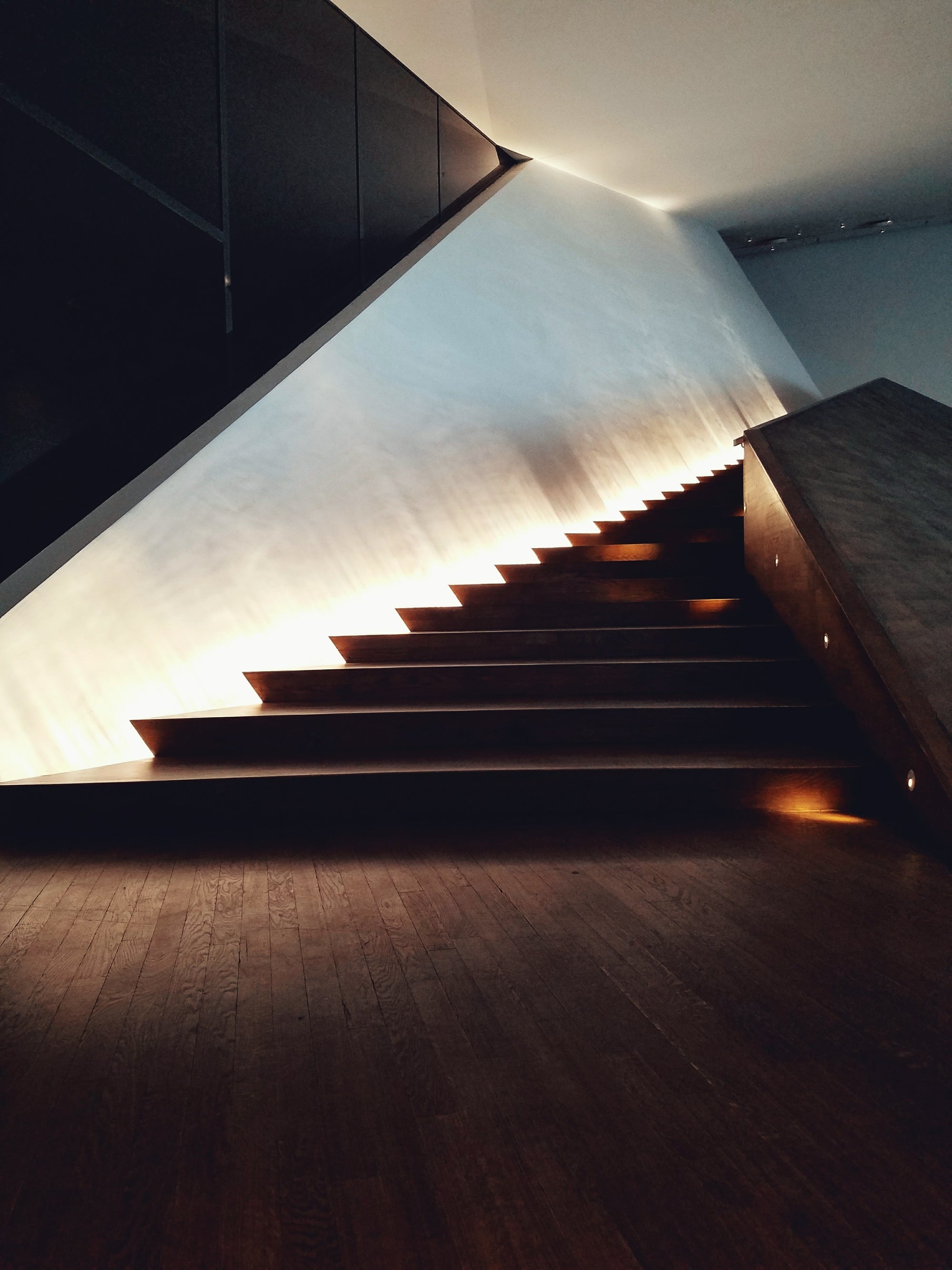 Modern staircase with built-in lighting in a minimalistic setting in EYE Filmmuseum, Amsterdam, Netherlands