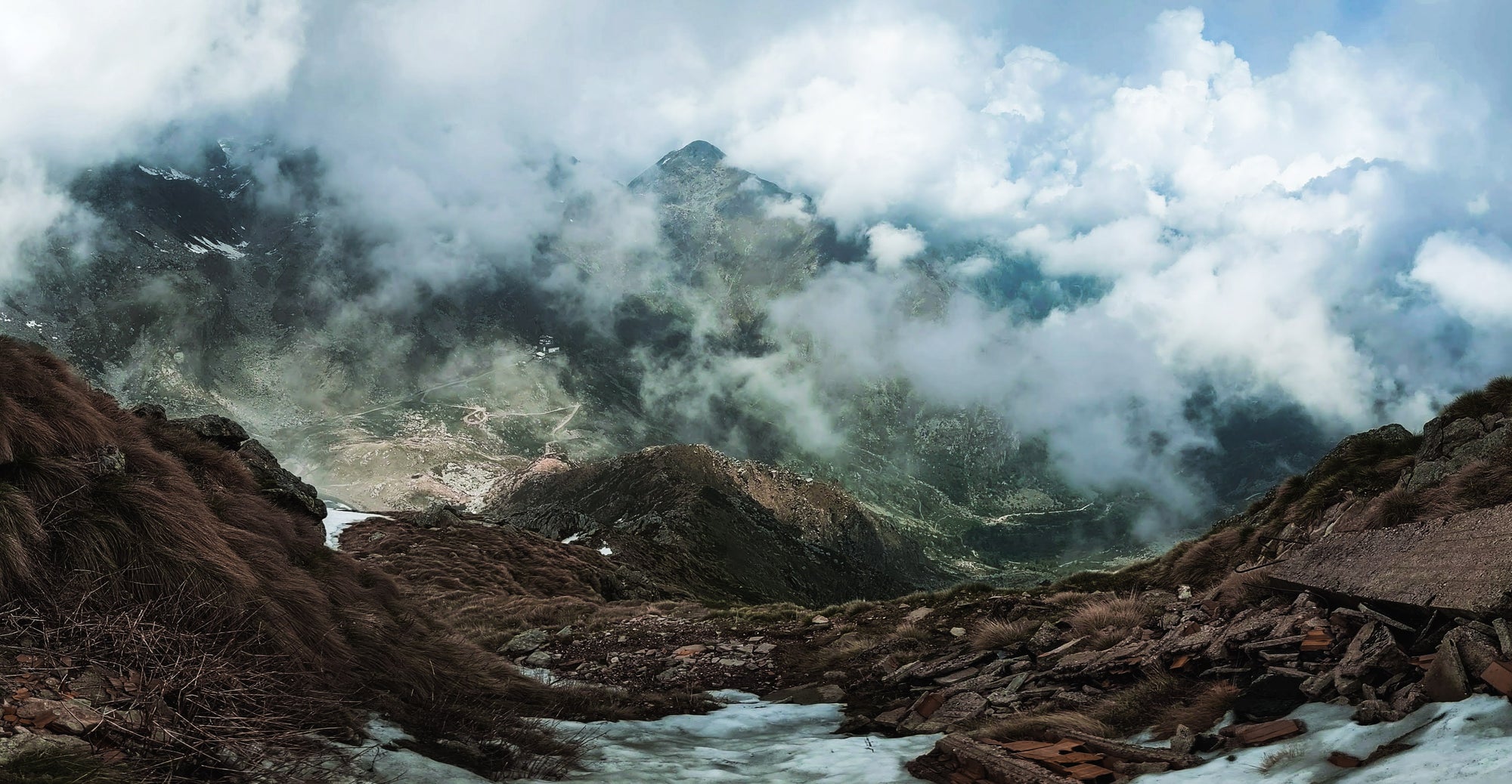 Mountain landscape with a river and clouds in Monte Mucrone, Italy