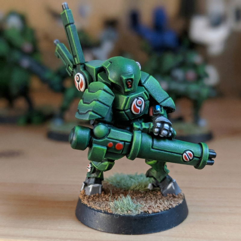 Warhammer 40,000 Tau XV15 Stealth Suit. Painted in a custom green and black "Black Ops" style color scheme.