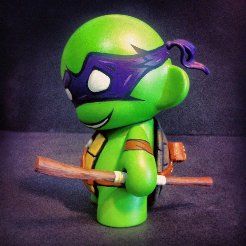 Custom-painted Donatello vinyl figure from the Teenage Mutant Ninja Turtles. The base figure is a Kidrobot DIY MUNNY